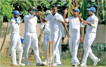  ??  ?? Lahiru Gamage (centre) celebrates during the warm-up match against India’s Board President’s XI