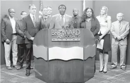  ?? MIKE STOCKER/SOUTH FLORIDA SUN SENTINEL ?? Broward Mayor Dale Holness, along with other officials from Broward County and public health officials, speaks Friday at a news conference on coronaviru­s at the Broward County Emergency Operations Center in Plantation.