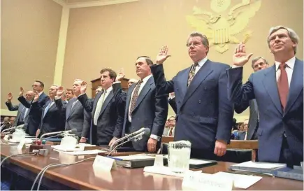  ?? FILE PHOTO BY JOHN DURICKA/AP ?? Heads of the nation’s largest cigarette companies are sworn in before House lawmakers on April 14, 1994, in hearings similar to what today’s drug companies could be facing amid a national epidemic of opioid abuse.