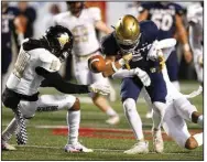  ?? (Arkansas Democrat-Gazette/Thomas Metthe) ?? Joe T. Robinson safety Chase Nichols (left) prepares to pounce on the ball after teammate Brandon Greil stripped it from Shiloh Christian’s Cooper Hutchinson during Saturday night’s game.