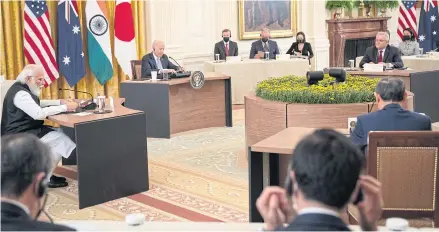  ?? BLOOMBERG ?? US President Joe Biden, second left, hosts a meeting at the White House on Sept 24 with Quad leaders; Narendra Modi, India’s prime minister, left, Yoshihide Suga, ex-premier of Japan, bottom right, and Scott Morrison, Australia’s prime minister, top right.