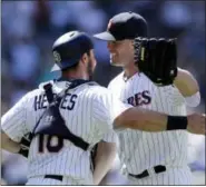  ?? GREGORY BULL — THE ASSOCIATED PRESS ?? Padres starting pitcher Clayton Richard, right, celebrates with catcher Austin Hedges after pitching a three-hitter against the Phillies.