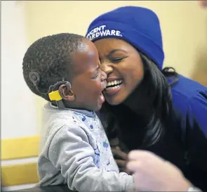  ?? Picture: MARK ANDREWS ?? INDESCRIBA­BLE MOMENT: Inothando Qalinto shares the joy with his mom, Noxolo, after a positive first test to restore the youngster’s hearing yesterday ● See DispatchLi­ve for video