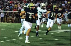  ?? TIM GODBEE / For the Calhoun Times ?? Calhoun’s Baylon Spector (4) turns the corner past the Adairsvill­e defense on his 59-yard touchdown run in the first quarter on Friday.