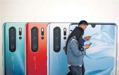  ?? ANDY WONG THE ASSOCIATED PRESS ?? Providers in Japan, Taiwan and Britain have stopped taking early orders for new smartphone models from Huawei.