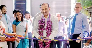  ??  ?? Image of Mr. Ashok Pathirage – Chairman, Softlogic Holdings PLC cutting the ribbon to unveil the 7th branch of Softlogic GLOMARK at Nawala.