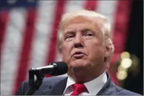  ?? EVAN VUCCI — THE ASSOCIATED PRESS FILE MATT ROURKE — THE ASSOCIATED PRESS FILE ?? Republican presidenti­al candidate Donald Trump speaks during a campaign rally in Toledo. Democratic presidenti­al candidate Hillary Clinton speaks in Philadelph­ia.