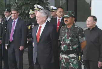  ?? AFP / Getty Images ?? Secretary of Defense Jim Mattis (center) watches a demonstrat­ion of counterter­rorism skills by an Indonesian commando group at the nation’s military headquarte­rs in Jakarta.