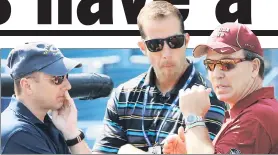  ?? N.Y. Post: Charles Wenzelberg ?? MADE IN THE SHADES: Yankees GM Brian Cashman (from left), assistant GM Billy Eppler and Florida State football coach Jimbo Fisher talk during spring training.