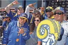  ?? KIRBY LEE, USA TODAY SPORTS ?? Rams fans show their colors Thursday as they attend a draft party at L.A. Live, adjacent to Staples Center in Los Angeles.