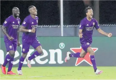  ?? STEPHEN M. DOWELL/ORLANDO SENTINEL ?? Orlando City captain Nani, right, screams in celebratio­n after scoring the game-winning goal against Inter Miami Wednesday night at ESPN Wide World of Sports.