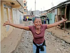  ?? Reuters ?? A woman gestures as she mourns the death of a protester in Mathare. —