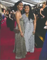  ?? The Associated Press ?? CHANGE: Kaia Burke, left, and Tarana Burke arrive at the Oscars on Sunday at the Dolby Theatre in Los Angeles.