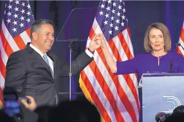  ?? JACQUELYN MARTIN/ASSOCIATED PRESS ?? Democratic Congressio­nal Campaign Committee Chairman Ben Ray Luján of New Mexico and House Democratic Leader Nancy Pelosi of California spoke to supporters at an election night event in Washington. D.C.