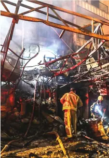  ?? — AFP photo ?? First responders search for survivors at the scene of an explosion at the Sina At’har health centre in the north of Iran’s capital Tehran northern Tehran.