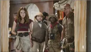  ?? FRANK MASI, SONY PICTURES ?? Karen Gillan, left, Jack Black, Kevin Hart and Dwayne Johnson star in "Jumanji: Welcome to the Jungle."