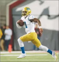  ?? Getty Images/tns ?? UCLA quarterbac­k Dorian Thompson-robinson carries the ball against Washington State at Martin Stadium on September 21, 2019, in Pullman, Washington.