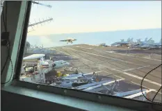  ?? Lolita Baldor / Associated Press ?? The view from the bridge as Marine Gen. Frank McKenzie, top U.S. commander for the Middle East, watches an F/A 18 fighter jet land on the USS Harry S. Truman on Saturday.