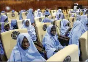  ??  ?? Students abducted by gunmen from the Government Girls Secondary School last week are seen after their release meeting with the state Governor Bello Matawalle, in Gusau, Tuesday.