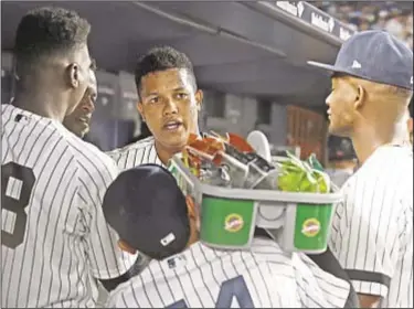  ??  ?? Luis Severino (l.) is pumped up for October now that his regular season is over, and Starlin Castro (above c.) is ‘interviewe­d’ by teammates after belting homer in win over Rays at Stadium.