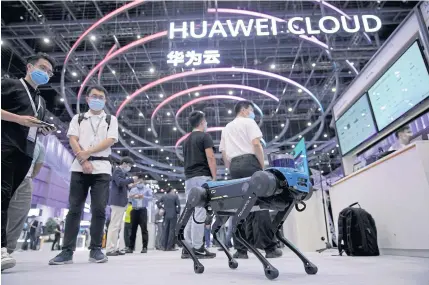  ??  ?? A robotic dog powered by Huawei Cloud is seen at a booth during Huawei Connect Conference in Shanghai yesterday.