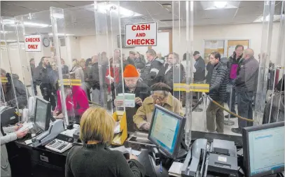  ?? Howard Schnapp ?? Newsday People line up Tuesday at the Town of Hempstead tax receiver’s office to pay their real estate taxes before the end of the year, hoping for one last chance to take full advantage of a major deduction.