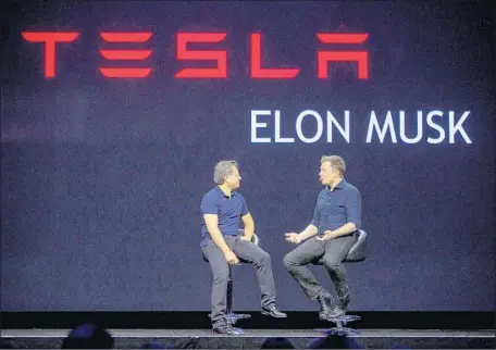  ?? Kim Kulish Getty Images ?? JEN-HSUN HUANG, chief executive of Nvidia, left, and Elon Musk, co-founder and CEO of Tesla, hold a discussion during the GPU Technology Conference in San Jose in 2015. Tesla’s board of directors is weighing a jaw-dropping 10-year, $55-billion pay plan...