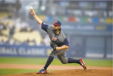  ?? Allen J. Schaben / Los Angeles Times / TNS ?? Washington’s Tanner Roark started for the U.S. and went four innings, allowing no runs on two hits, a walk and a hit batter. In his only previous appearance in the tournament, he had given up three runs in 11⁄3 innings.