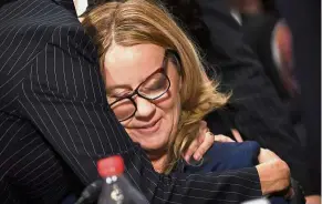  ?? — AFP ?? Tough call: Blasey Ford being comforted by her attorney at the end of her testimony on Capitol Hill in Washington, DC.