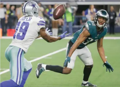  ?? AP ?? Receiver Amari Cooper makes the game-winning catch after it was deflected by Eagles cornerback Rasul Douglas.