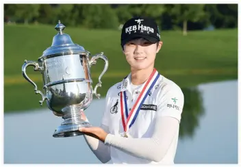  ??  ?? Sung Hyun Park poses with the champion trophy after winning the final round of the US Women’s Open golf tournament at Trump National Golf Club-New Jersey on Sunday. (USA TODAY Sports)