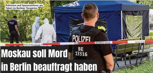  ??  ?? Polizisten und Spurensich­erer am Tatort im Berliner Tiergarten