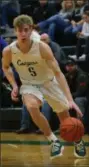  ?? BY DAVID TURBEN — FOR THE NEWS-HERALD ?? Lake Catholic’s Luke Frazier handles the ball during the Cougars’ game against Gilmour Nov. 30.