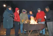  ?? Contribute­d photo ?? The YMCA’s annual Freezin’ for a Reason fundraiser and awareness event will be held Dec. 13 at East End Park in Winsted. Above, participan­ts at a previous event warm up.