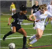  ?? AUSTIN HERTZOG — MEDIANEWS GROUP ?? Pennridge’s Leah Malone, left, controls the ball as North Allegheny’s Kena Shannon defends during the PIAA 4A championsh­ip game in Hershey on Saturday.