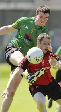  ??  ?? Hollywood’s Conor Burke has his shot blocked by Coolkenno’s Jim Cushe.