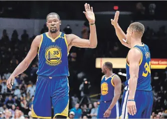  ?? ASSOCIATED PRESS FILE PHOTO ?? Kevin Durant, left, and Stephen Curry won two National Basketball Associatio­n championsh­ips in three years together with the Golden State Warriors. Durant joined the Brooklyn Nets this off-season as a free agent.