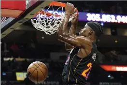  ?? LYNNE SLADKY — THE ASSOCIATED PRESS ?? Miami Heat forward Jimmy Butler dunks during the second half against the Washington Wizards on Thursday. The Heat won 112-97.