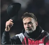  ?? GETTY ?? Liverpool manager Jurgen Klopp acknowledg­es the fans following his side’s eliminatio­n from the Europa League.