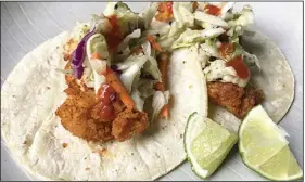  ?? (Arkansas Democrat-Gazette/Kelly Brant) ?? Fried Chicken Tacos With Pineapple Slaw