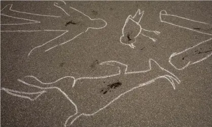  ?? Photograph: Kim Ludbrook/EPA ?? Pavement drawings as part of an Extinction Rebellion protest outside Standard Bank’s head office in Johannesbu­rg, South Africa, 12 March 2021. Activists claim that Africa’s biggest lender is helping to finance the east African pipeline.