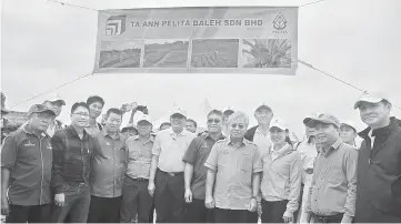  ??  ?? Masing (front, fourth right) arrives to officiate at the launch of the oil palm plantation project. With him (from third left) are Penghulu Sallang, Douglas, Joseph, Nyabong, Ting Lina and Elvis.