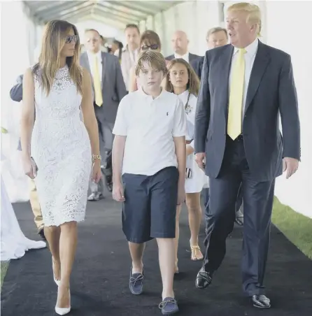  ?? PICTURE: GETTY ?? 0 Donald Trump with wife Melania and youngest son Barron at the Mar-a-lago Club in Florida