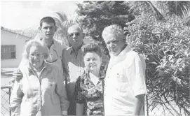  ??  ?? Victor Arrieta, above, back row left, next to his father, with relatives in Miami about 1995. Arrieta, far right, in his native Brazil with his Cuban-born father.