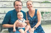  ??  ?? Kevin Haulbert, 37, with his wife Christine Bottomley, 37, and their 10-month-old son, Benjamin, says he is frustrated by mixed messaging from the government and public health officials.