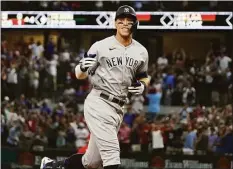  ?? LM Otero / Associated Press ?? The New York Yankees’ Aaron Judge gestures as he runs the bases after hitting a solo home run, his 62nd of the season, during the first inning against the Texas Rangers on Oct. 4.