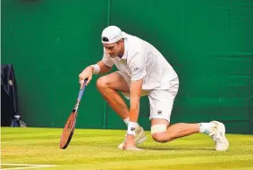  ?? GLYN KIRK/ASSOCIATED PRESS ?? American John Isner was seeking to reach the first Grand Slam final of his career, but he fell in five sets Friday to Kevin Anderson at Wimbledon.