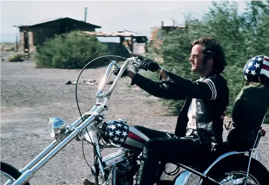  ?? GETTY ?? Peter Fonda as Wyatt, aka Captain America, in the 1969 film Easy Rider and, below, in 2014.