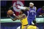  ?? MATT SLOCUM — THE ASSOCIATED PRESS ?? Mike Scott, right, trying to block a shot by Indiana’s Edmond Sumner, filled in nicely in the starting lineup for Tobias Harris. Scott scored 11 points in 25 minutes as the 76ers rolled over the Pacers, 130-114.