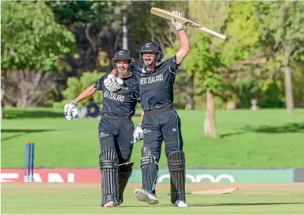  ?? PHOTOSPORT ?? Kristian Clarke, left, and Joey Field celebrate New Zealand’s win over Sri Lanka.